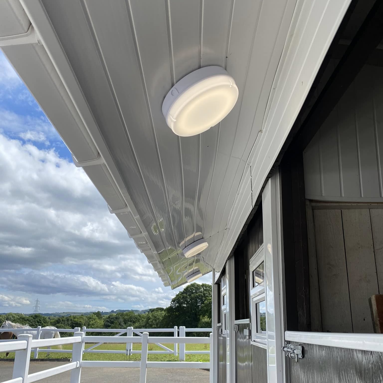 Soffit lighting along a stable block