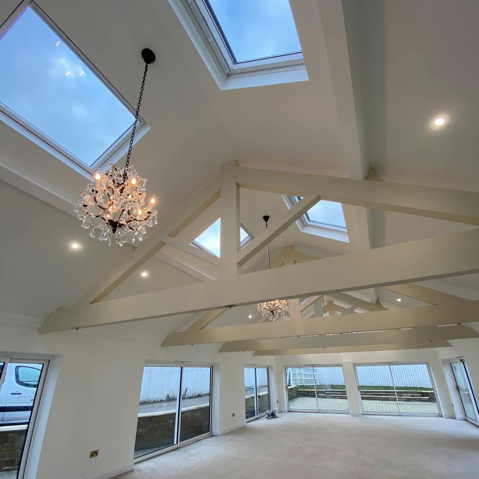 Lighting through a vaulted extension with exposed trusses